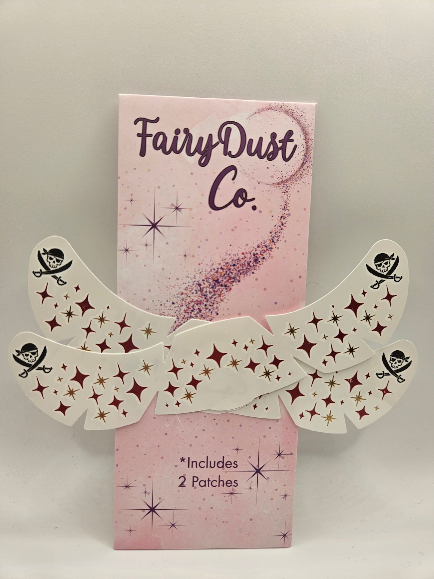 set of 2 pirate face tattoos with red and gold stars