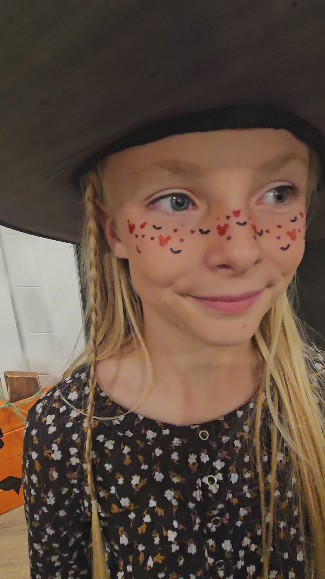 girl wearing mickey mouse and bat face freckles